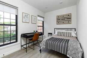 Poughkeepsie apartment for rent - A bedroom with a bed, desk, and chair.