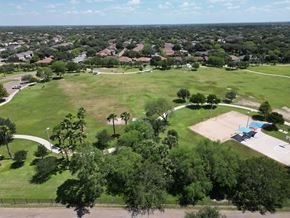 Mcallen apartment for rent - A park with a basketball court and a playground.