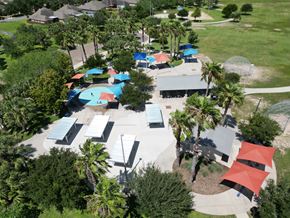 Mcallen apartment for rent - A park with a playground and picnic tables.