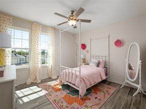 Mcallen apartment for rent - A bedroom with a pink bed and a white canopy bed.