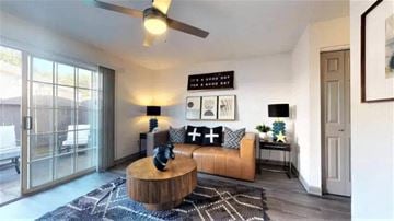 Smyrna apartment for rent - A living room with a brown leather sofa and a wooden coffee table.