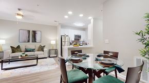 Atlanta apartment for rent - A modern dining room with a glass table and green chairs at Embry Hills, Atlanta, GA