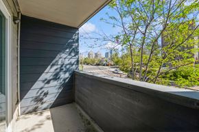 Oakland apartment for rent - A balcony with a view of a cityscape and trees. at Oak Center Apartments, Oakland, CA, 94607