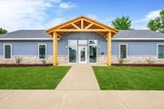 Springfield apartment for rent - A building with a wooden front entrance and a glass door at Poplar Place Apartments, Springfield, IL 62703