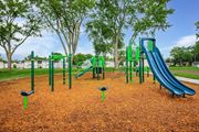 Springfield apartment for rent - A playground with a green slide and a blue slide at Poplar Place Apartments, Springfield
