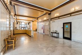 New London apartment for rent - A spacious room with a wooden floor and a large window at Mohican Apartments, New London