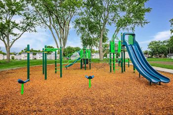 2.5 Acres of green lawn for all to enjoy with walking paths and playground