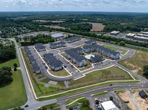 Charlotte apartment for rent - A bird's eye view of a residential complex with multiple buildings and roads.