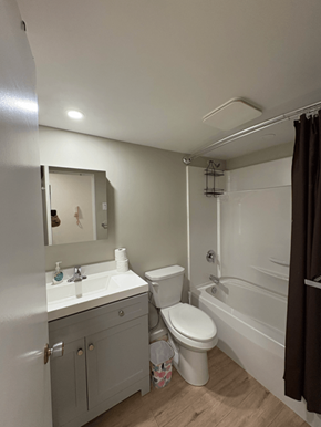 Courtenay apartment for rent - A bathroom with a toilet, sink, and bathtub.