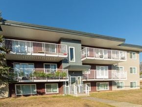 Prince George apartment for rent - Apartment building with balconies and a clear blue sky.