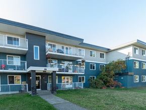 Prince George apartment for rent - A building with a blue and white exterior and a balcony.