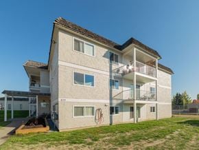 Prince George apartment for rent - A modern two-story apartment building with a balcony on the second floor.