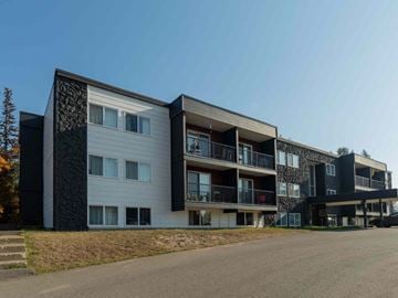 Prince George apartment for rent - A modern apartment building with balconies and a clear sky.