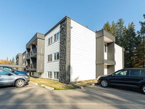 Prince George apartment for rent - A modern two-story building with a parking lot in front.