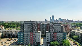 Edmonton apartment for rent - A cityscape with apartment buildings in the foreground and a city skyline in the background.