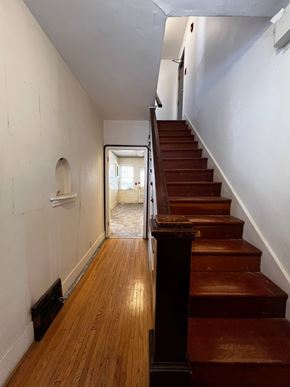 Edmonton apartment for rent - A room with a white floor and a brown wooden wall.