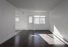 Edmonton apartment for rent - A room with a white door and a window with white blinds.