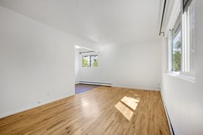 Edmonton apartment for rent - A room with wooden flooring and a window.