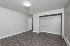 Edmonton apartment for rent - A room with a grey floor and a white ceiling with a light on.