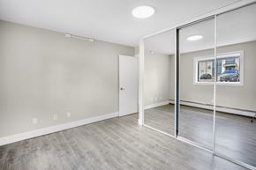 Edmonton apartment for rent - A room with a white door and a picture on the wall.