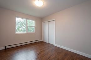 Edmonton apartment for rent - A room with a window and a closed door.