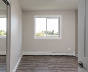 Edmonton apartment for rent - A room with a window and a door.
