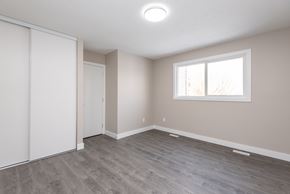 Edmonton apartment for rent - A room with a sliding door and a window.