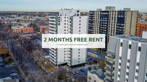 Edmonton apartment for rent - A cityscape with apartment buildings and a sign offering 2 months free rent.
