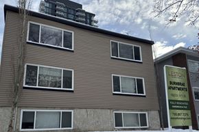 Edmonton apartment for rent - A sign for Lestown Burnbrae Apartments is displayed in front of a building.