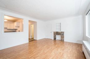 Edmonton apartment for rent - A room with wooden floors and white walls.