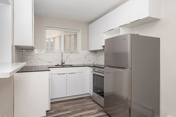 Edmonton apartment for rent - A modern kitchen with a stainless steel refrigerator.