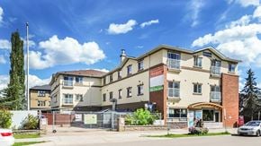 Edmonton apartment for rent - A large building with a sign that says "RESIDENCIES" in front of it.