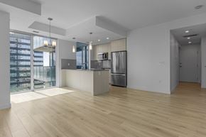 Edmonton apartment for rent - A kitchen with a refrigerator, stove, and oven is shown.