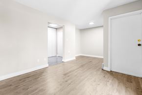 Edmonton apartment for rent - A room with a white door and a window with blinds.