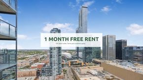 Edmonton apartment for rent - A cityscape with a building under construction and a sign offering a 1 month free rent.