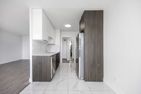 Edmonton apartment for rent - A modern kitchen with a white countertop and a sink.