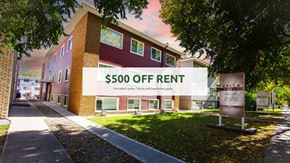 Edmonton apartment for rent - A building with a sign that says "$500 OFF RENT" in front of it.