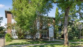 Edmonton apartment for rent - A building with a sign that says "Kollegium" in front of it.