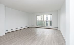 Edmonton apartment for rent - A room with a window and wooden flooring.