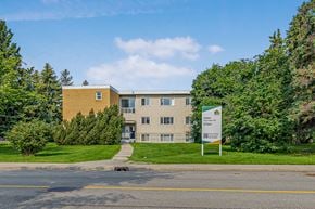 Edmonton apartment for rent - A building with a sign in front of it.