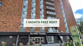 Edmonton apartment for rent - Oliver Tower building with a sign offering a free one month rent.