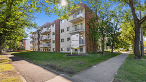 Edmonton apartment for rent - Apartment building with a walkway in front of it.