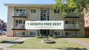 Edmonton apartment for rent - A building with a sign that says "1 MONTH FREE RENT" in front of it.