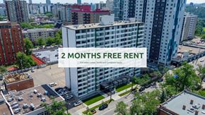 Edmonton apartment for rent - A large white building with the text "2 MONTHS FREE RENT" in the foreground.
