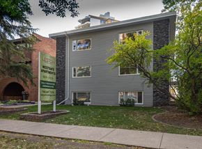 Edmonton apartment for rent - A sign for Leston Westgate Apartments is in front of a grey building.