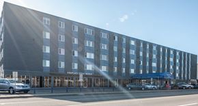 Edmonton apartment for rent - A large building with the words "FIREPLACE STONE WORLD" on the front.