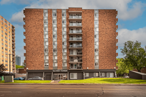 Edmonton apartment for rent - Oliver Tower is a tall brick building with many windows.