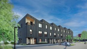 Orillia apartment for rent - A modern building with a black facade and large windows at The Grove Apartments, Orillia
