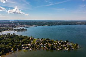 Orillia apartment for rent - A small island with houses and boats surrounded by water. at The Grove  Apartments, Orillia, ON