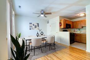 Lakewood apartment for rent - A dining room with a white table and chairs.